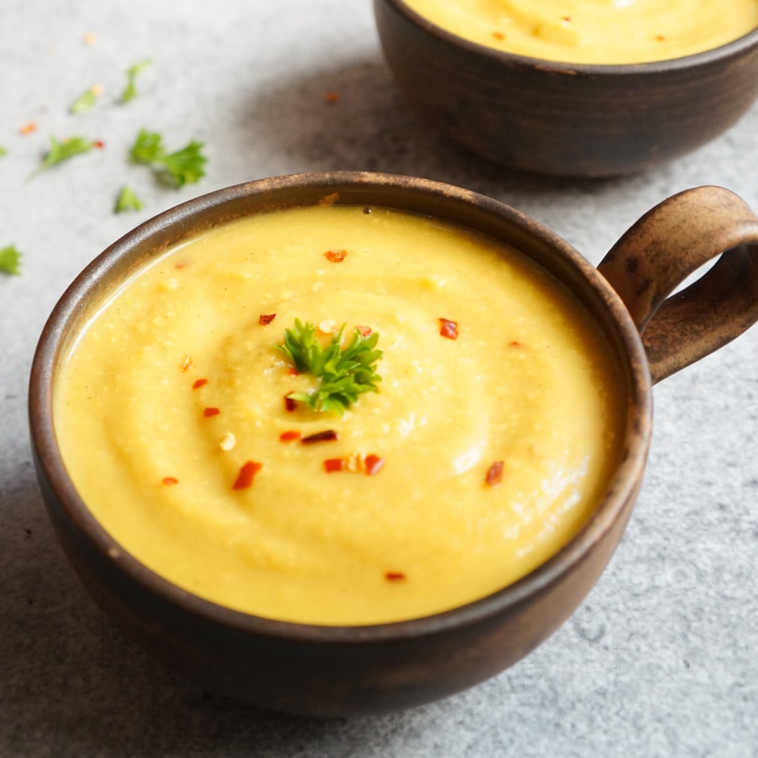 Cauliflower Soup made in the instant pot in a bowl topped with red chili flakes