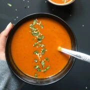 Roasted Red Pepper and Carrot Soup served in a bowl