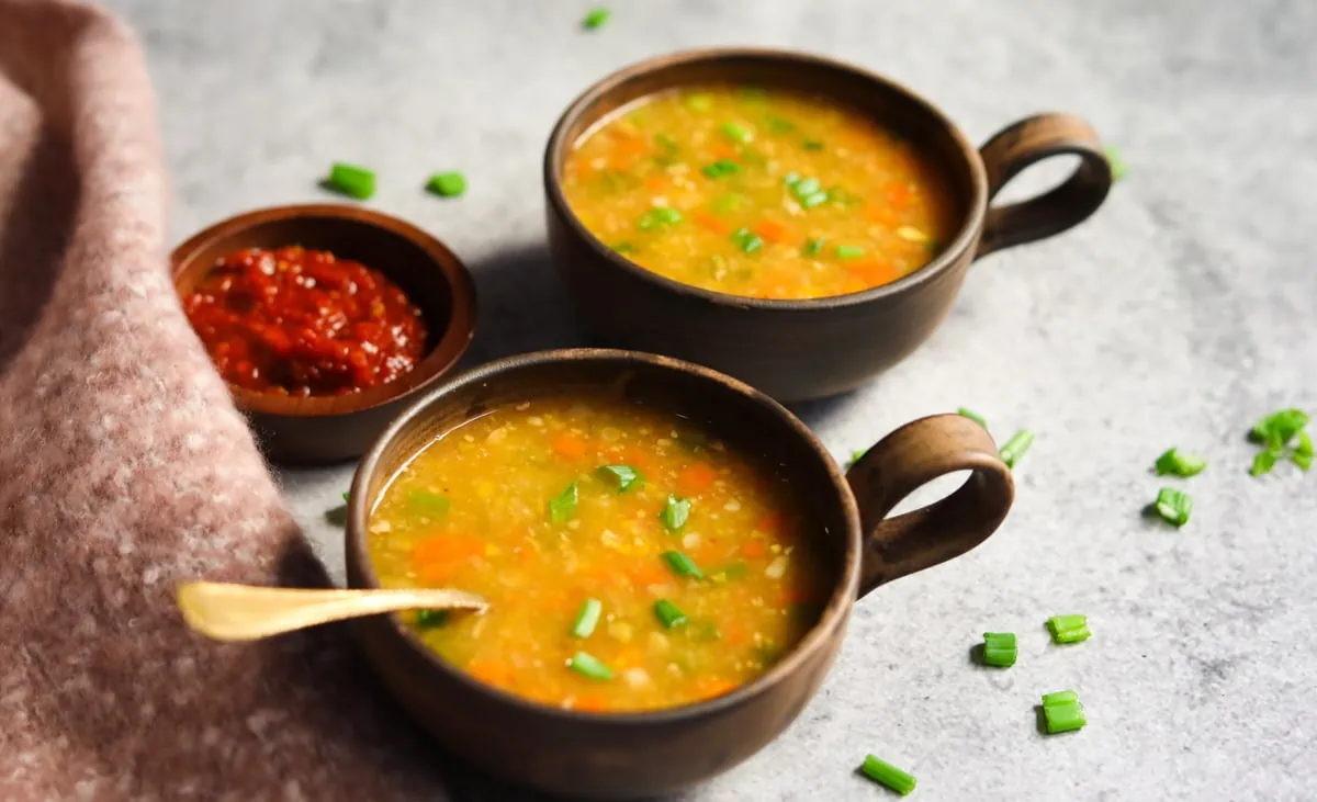 Indo-Chinese Sweet Corn Soup served in two bowls.