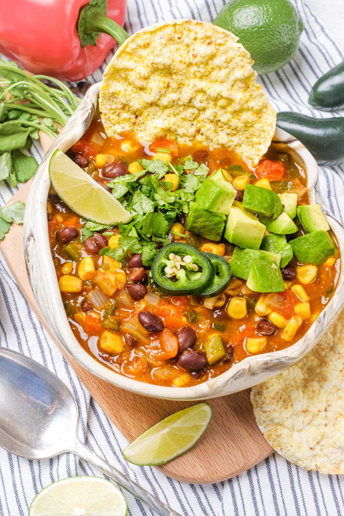 Vegetarian Taco Soup in a bowl with lots of garnishes. 