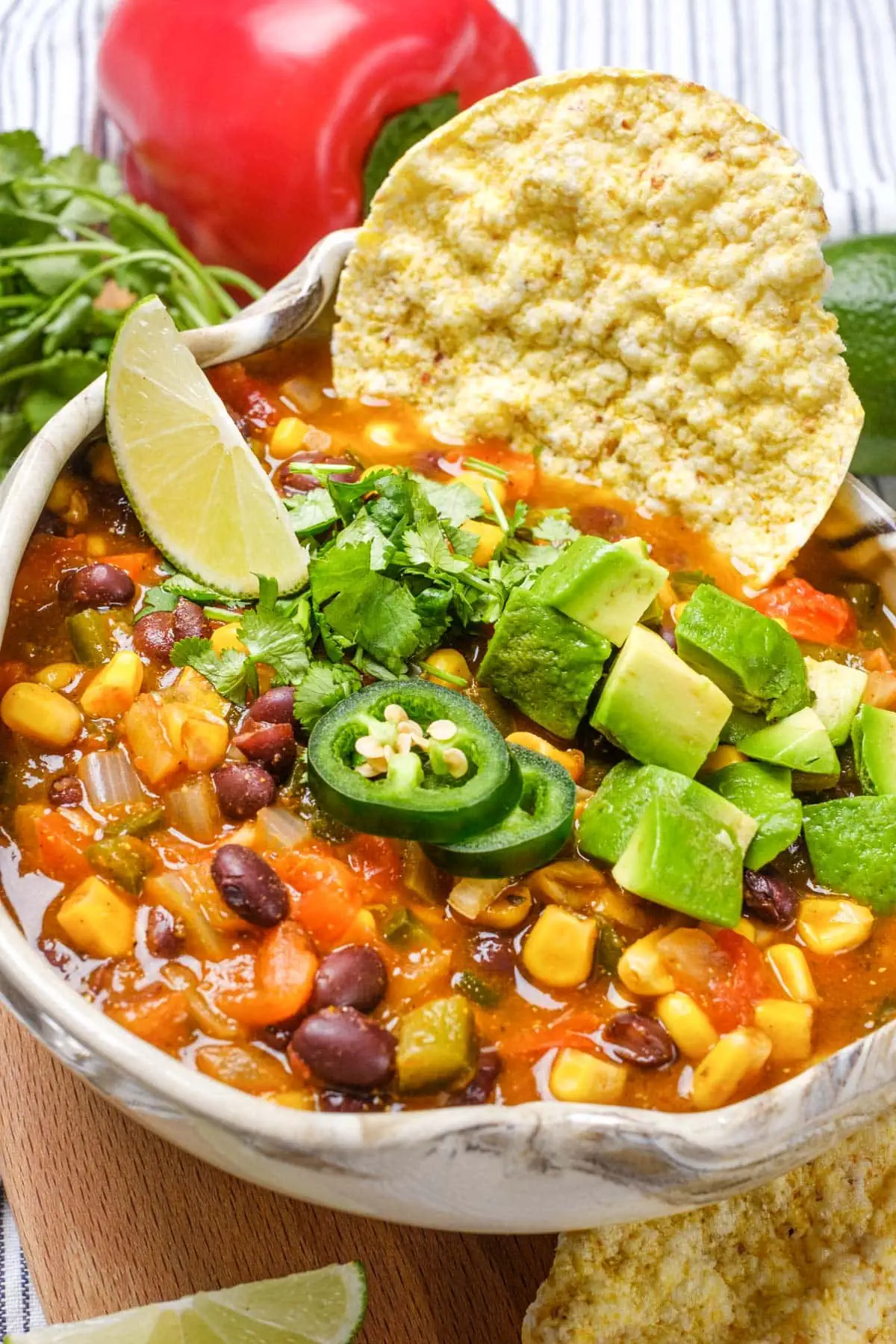 Vegetarian Taco Soup in a bowl topped with jalapeno and avocado