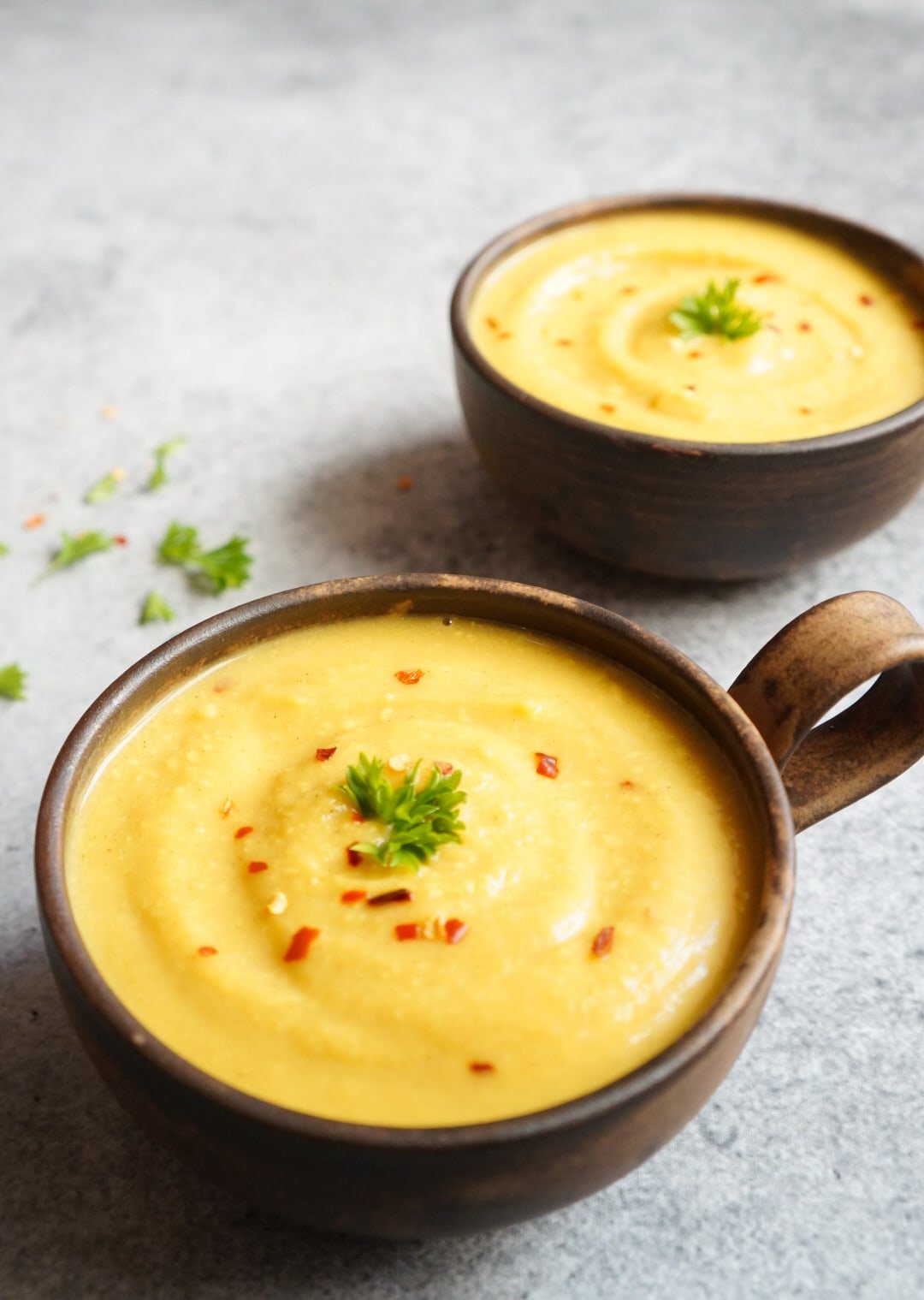 Instant Pot Cauliflower Soup in a bowl topped with red chili flakes