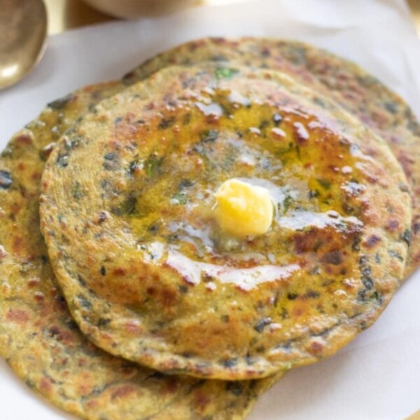 methi paratha topped with butter