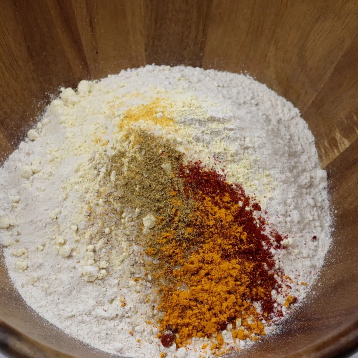 Add spices to the dough in a bowl