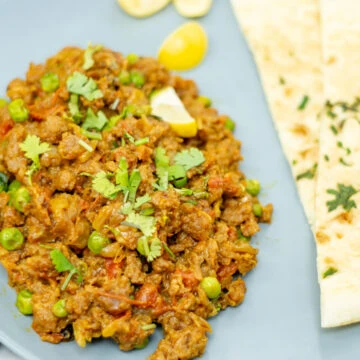 keema matar garnished with cilantro