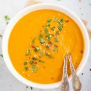 carrot soup garnished with cilantro