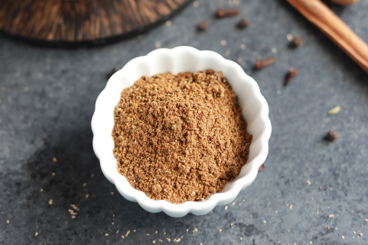 Garam masala spice mix in a small white bowl