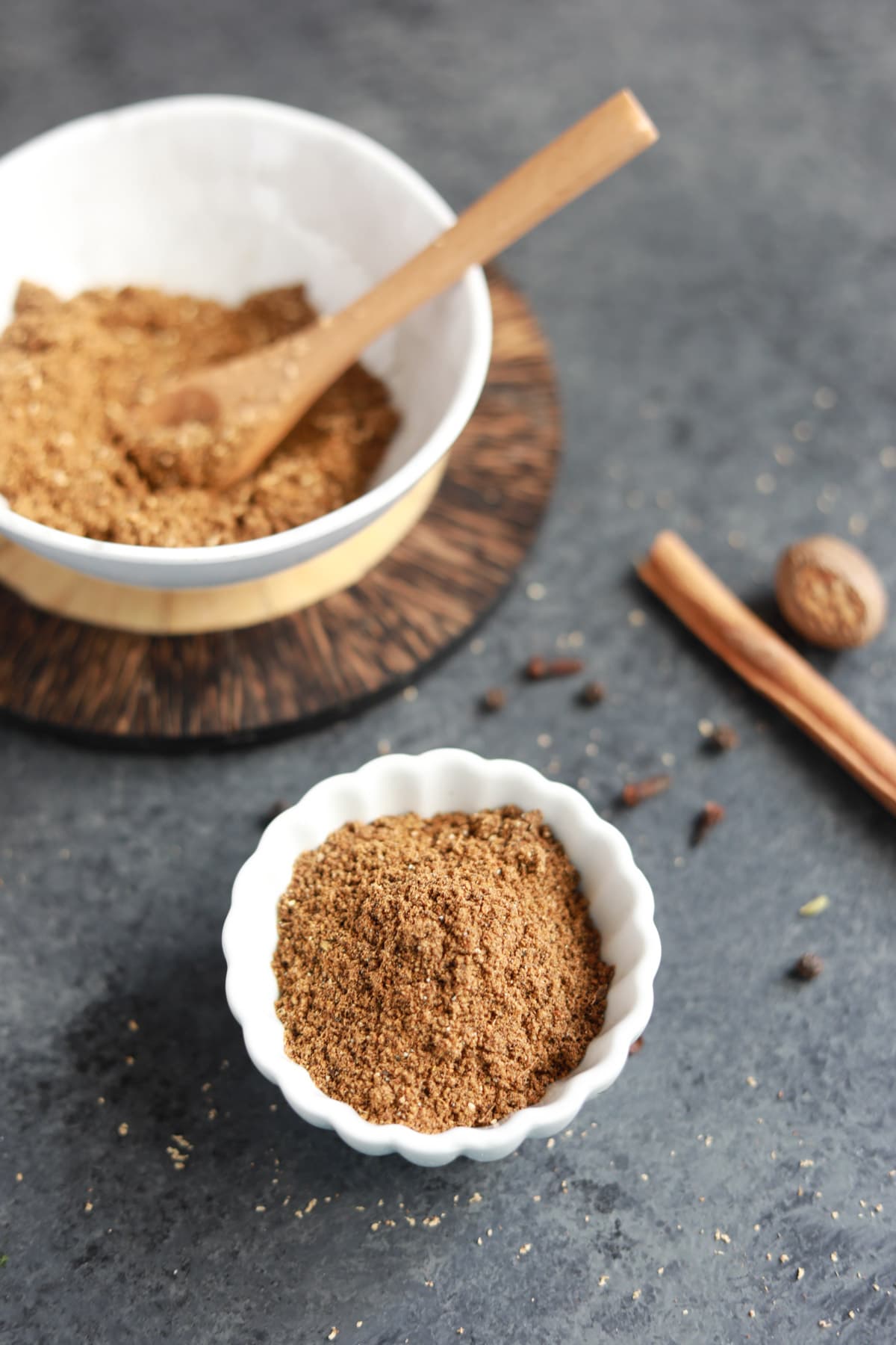 Garam masala spice powder in a small white bowl