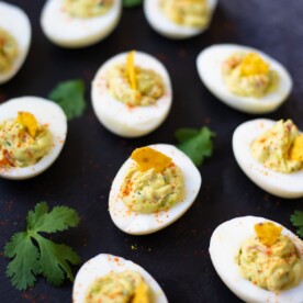 Guacamole Deviled eggs on a platter