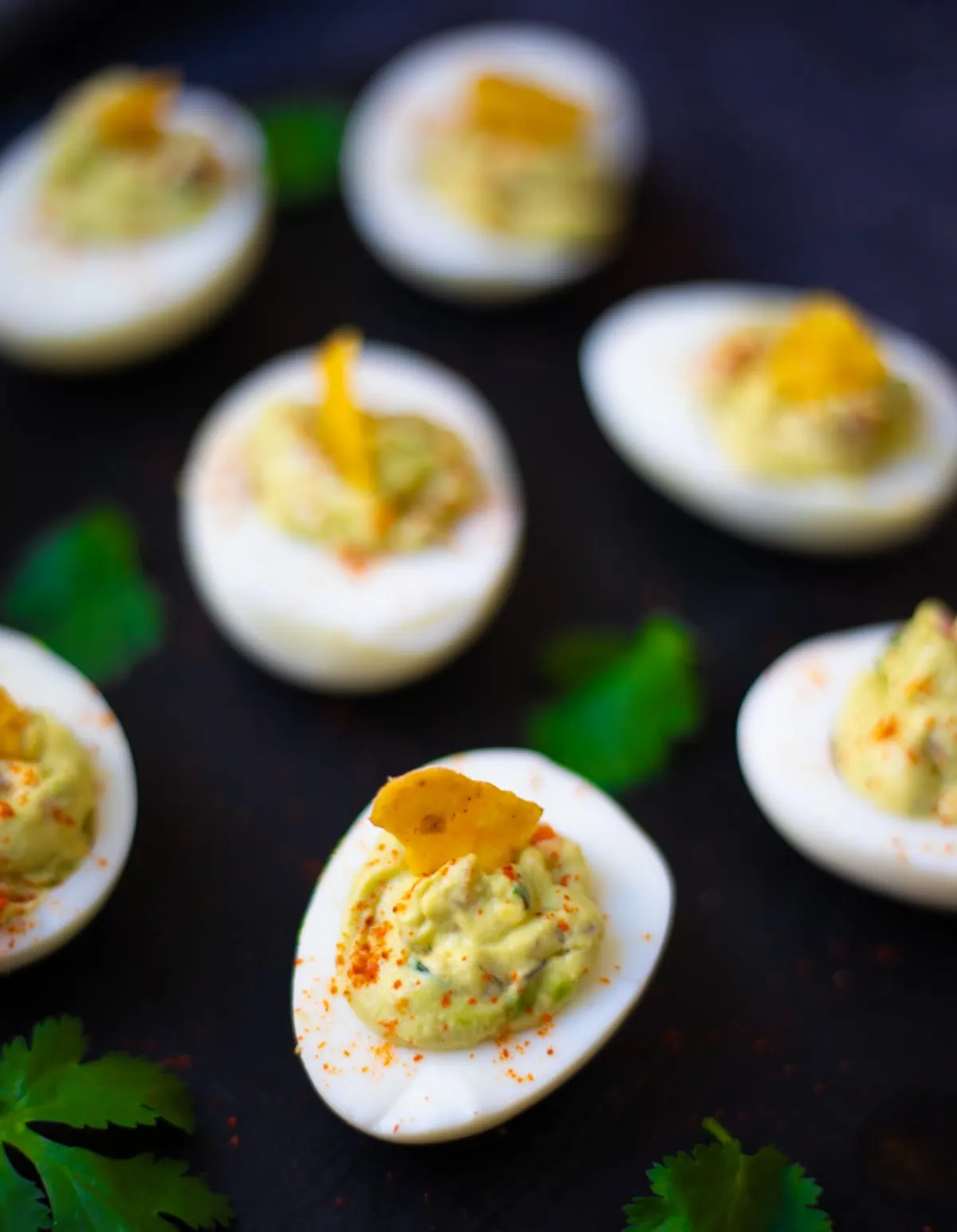 Mexican style Guacamole Deviled Eggs on a platter