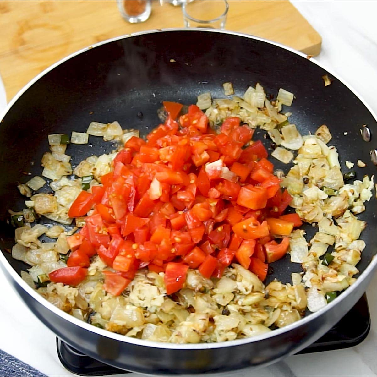 add diced tomatoes to the pan