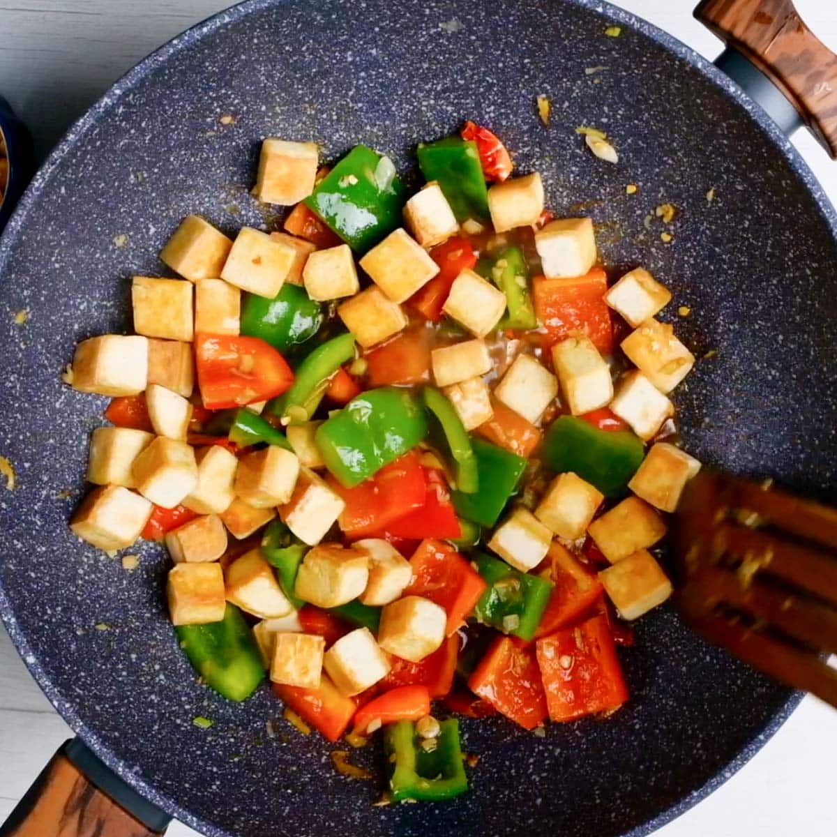 Mix the veggies with tofu in a pan