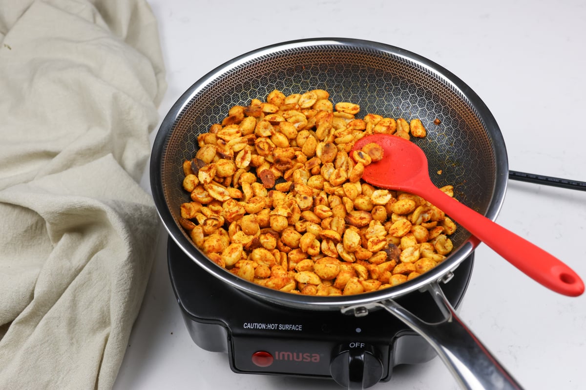 Masala peanuts in a pan