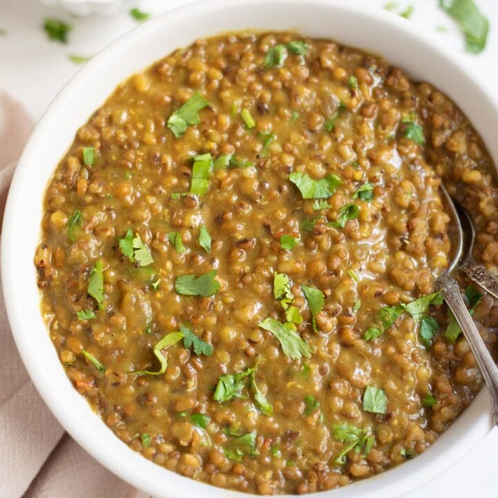 Moth dal in a bowl garnished with cilantro