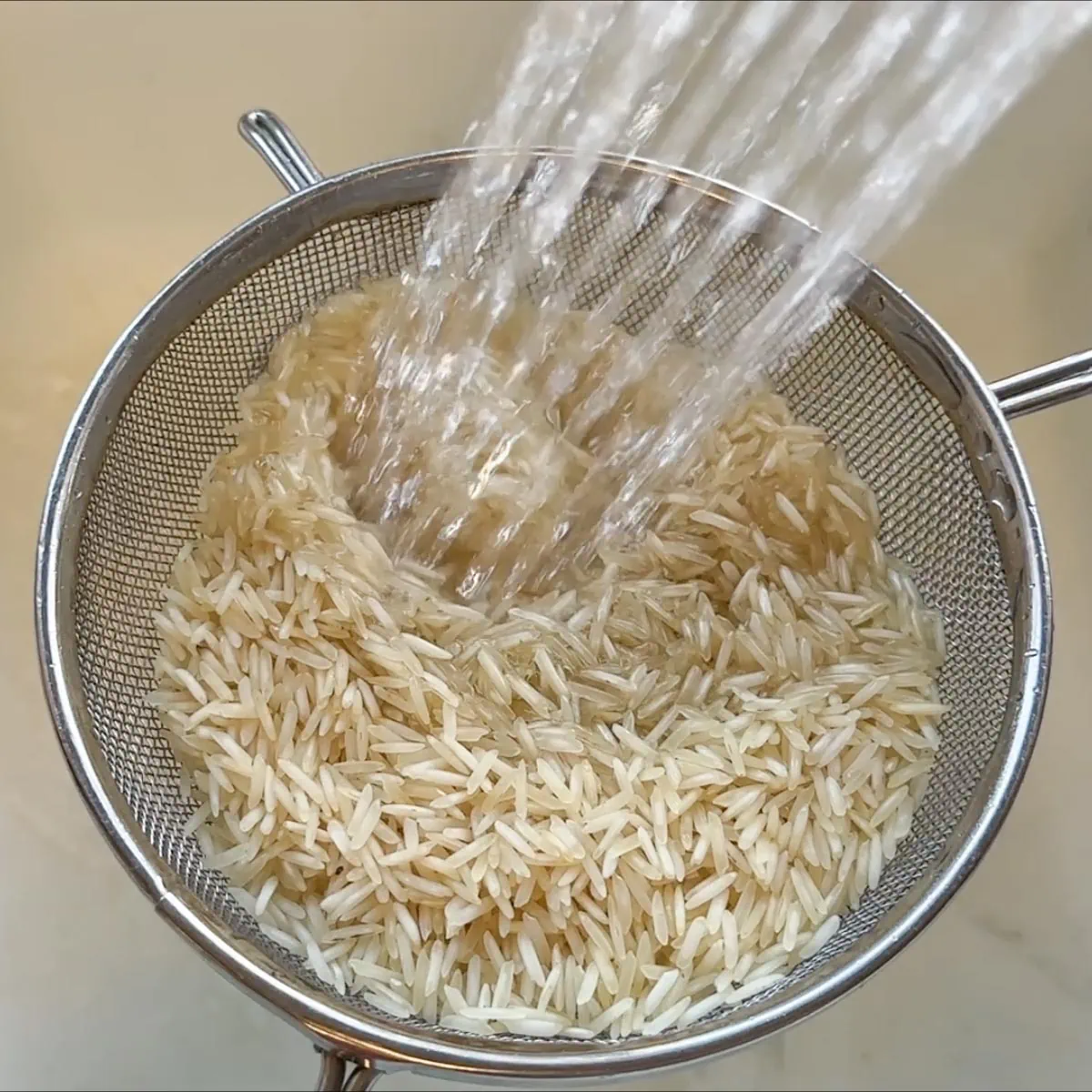 wash the rice in a strainer