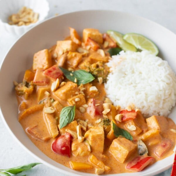 panang curry tofu garnished with basil leaves