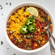 Quinoa chili in a bowl with spoons