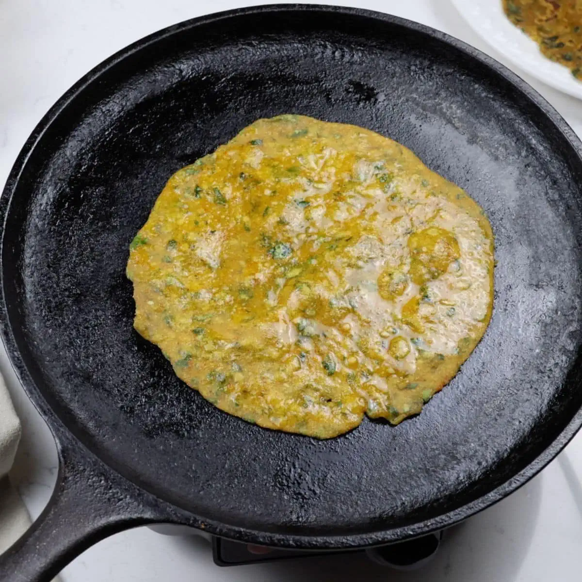 add oil to thepla to tawa