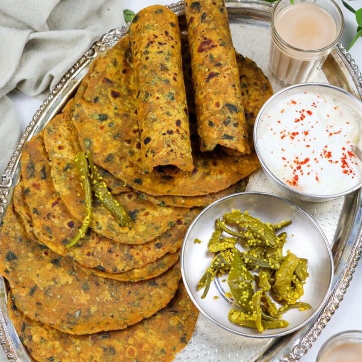 methi theplas stacked in a tray