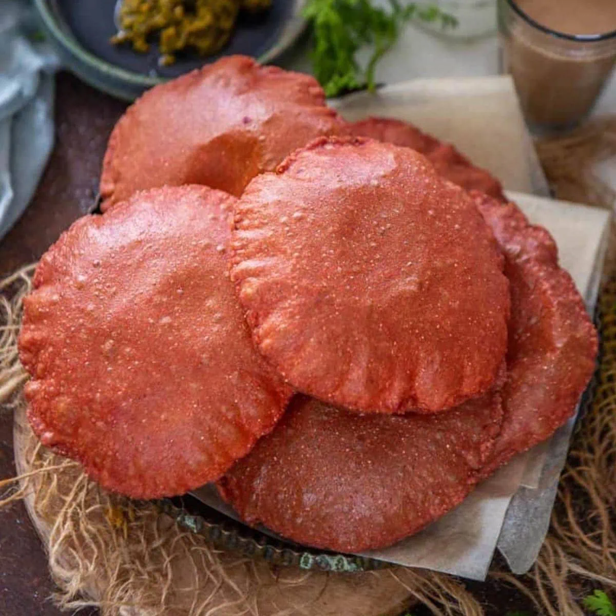 Beetroot poori served on a plate.