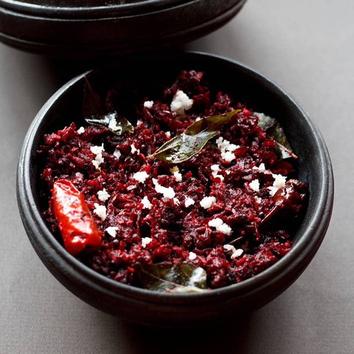 beetroot thoran served in a black bowl.