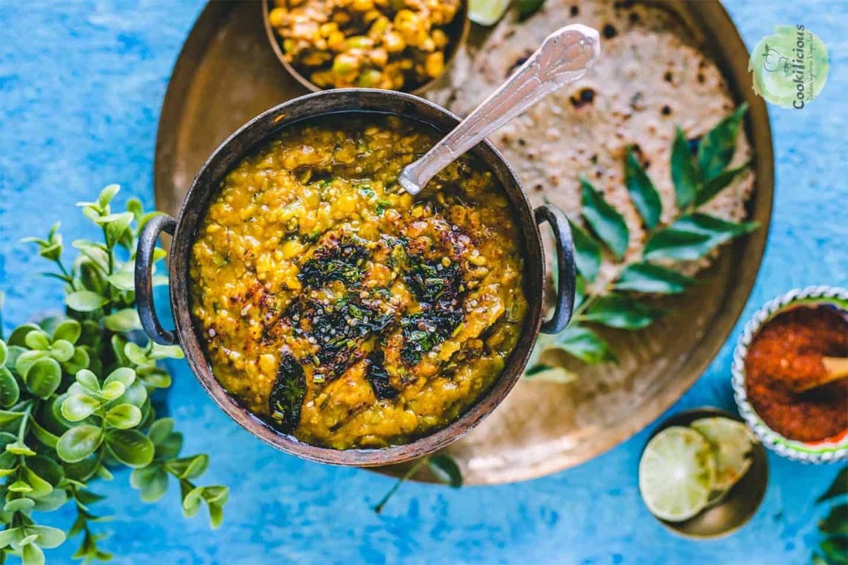 Methi Dal served in a small kadai with a spoon in it