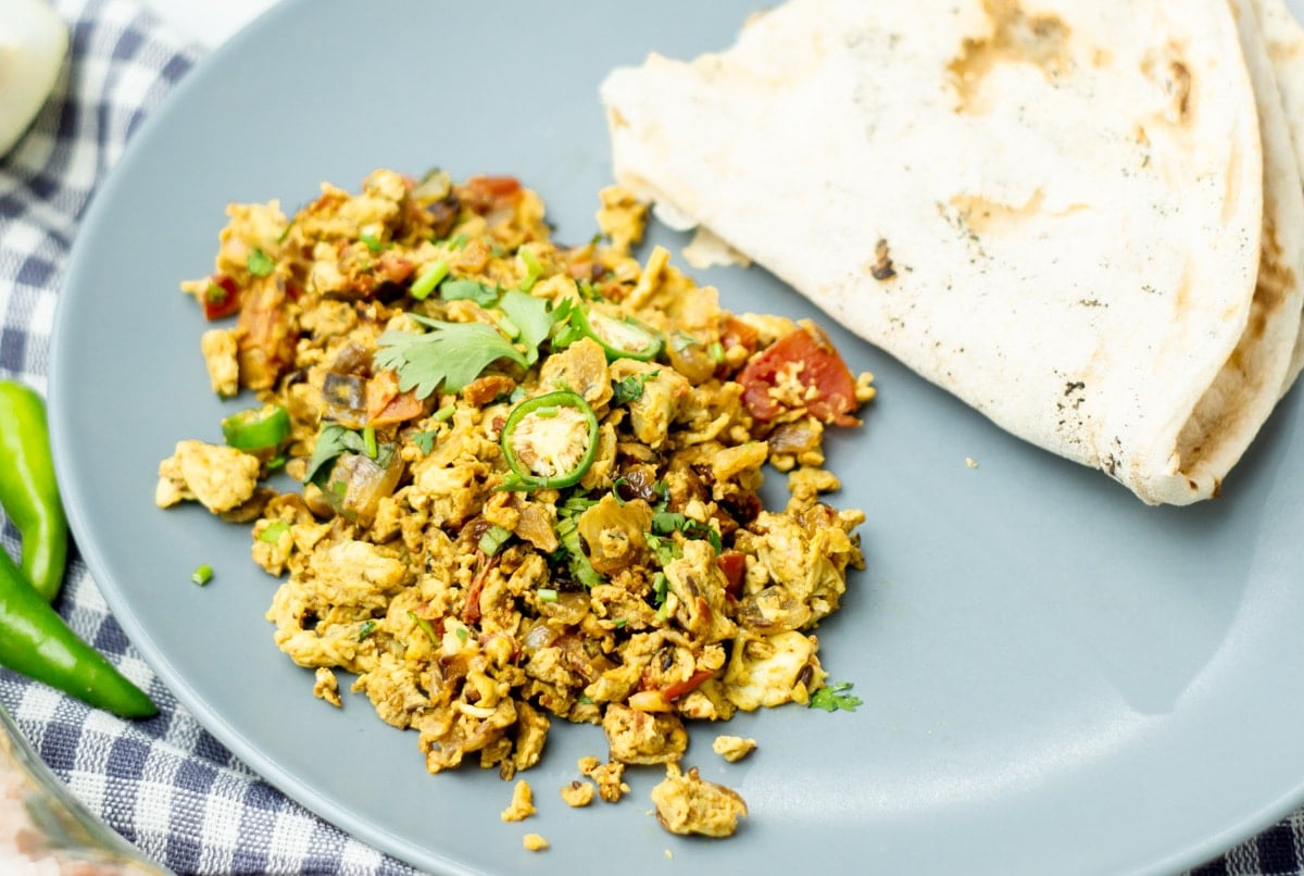 Egg bhurji on a plate with roti