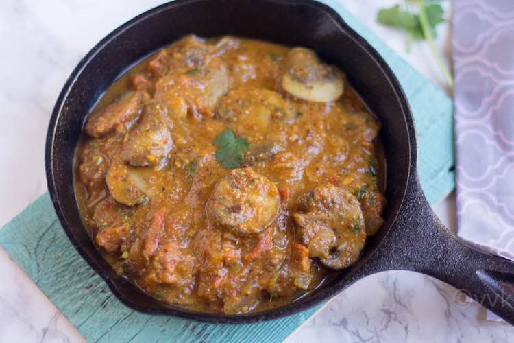 Goan Mushroom Xacuti in a cast iron pan.