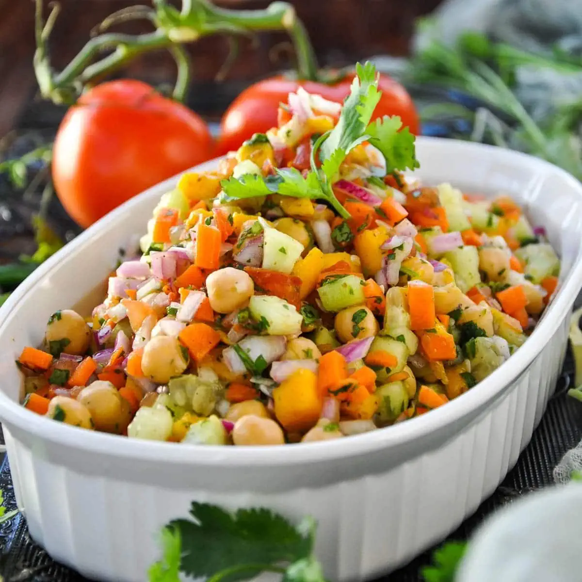 Mango Chickpea Kachumber Salad in a white serving bowl