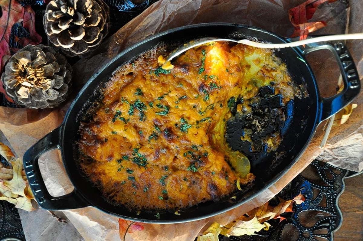 Masala scalloped potatoes in a iron cast