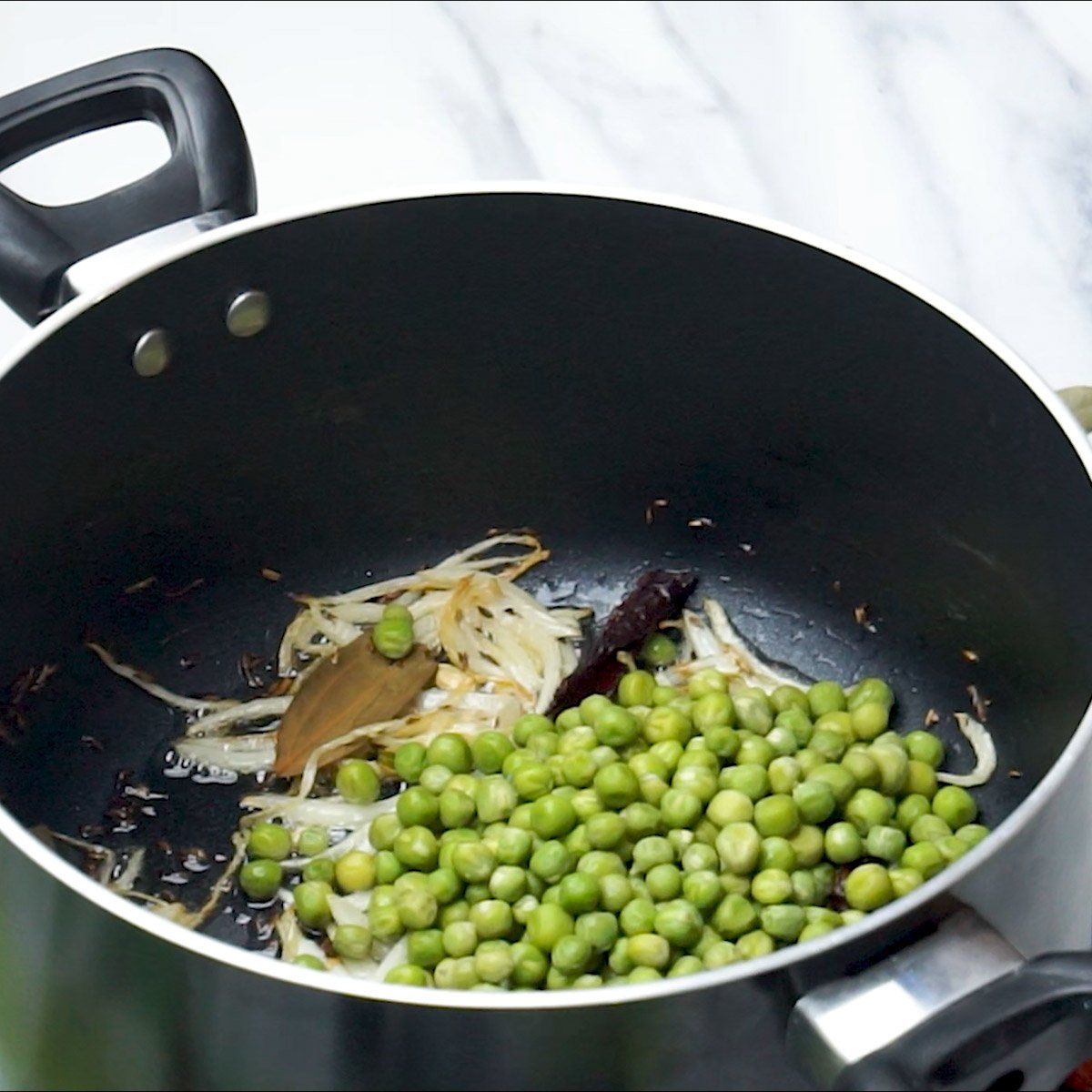 add Green Peas to the pot and mix