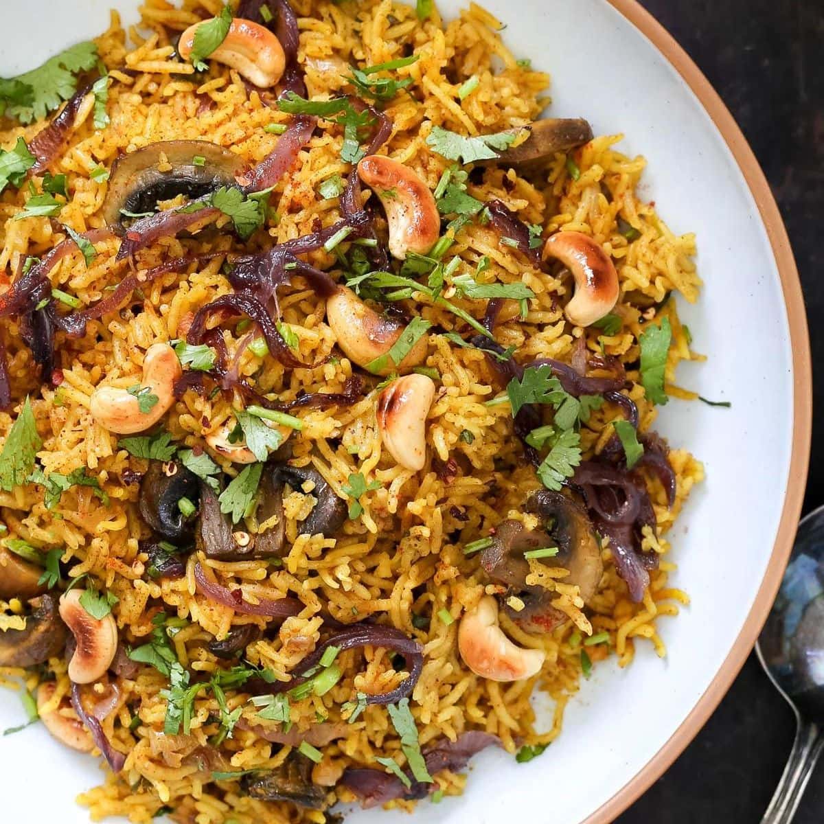 Mushroom biryani in a white plate