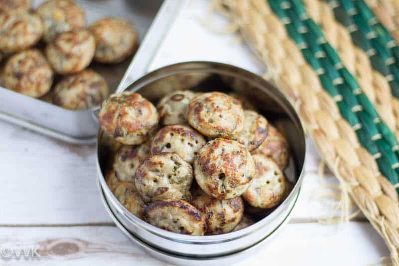 Mushroom Paniyaram in a steel container.