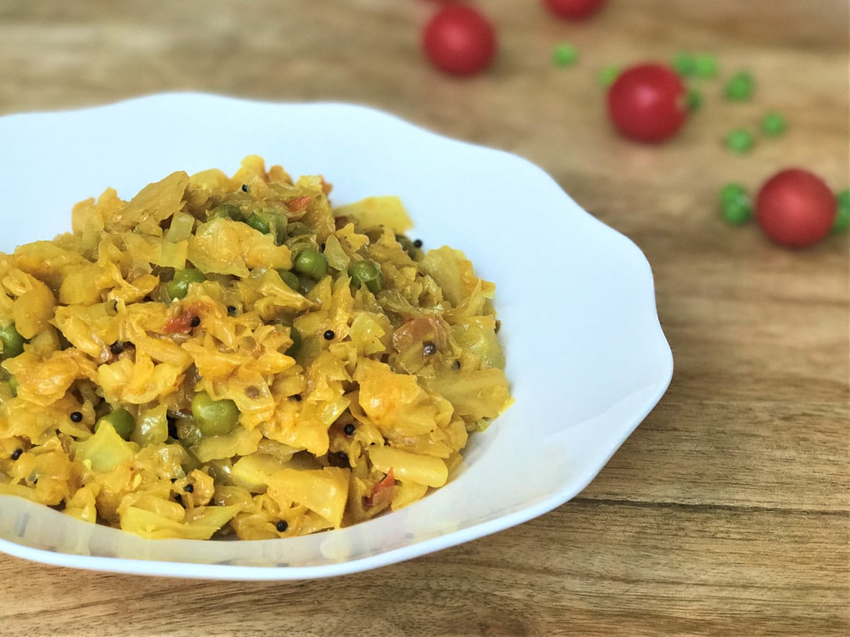 Cabbage peas (patta gobi matar) in a white bowl