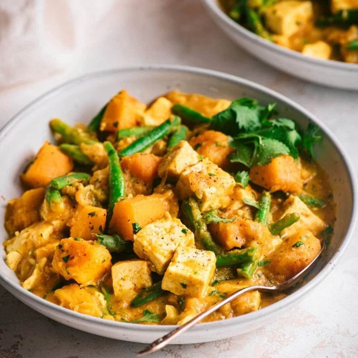 pumpkin curry with tofu in a bowl