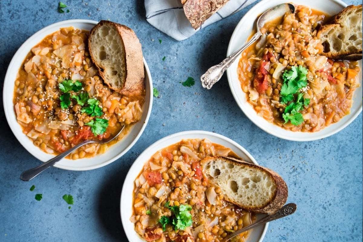 Lentil and Cabbage Soup in three bowls