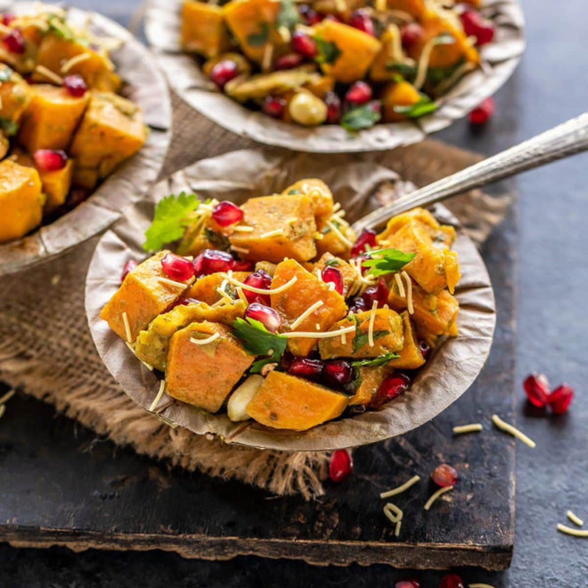 Sweet potato chaat in a paper bowl