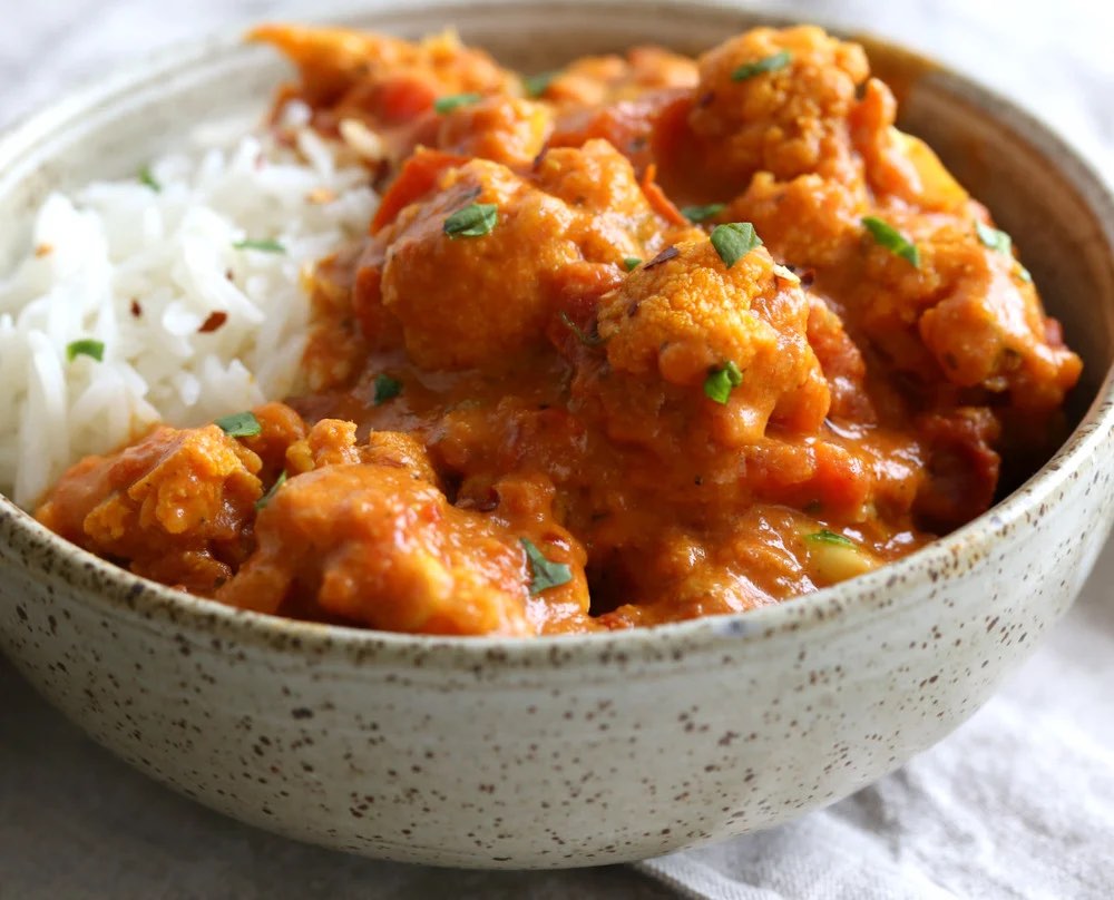 Cauliflower tikka masala in a bowl with rice 