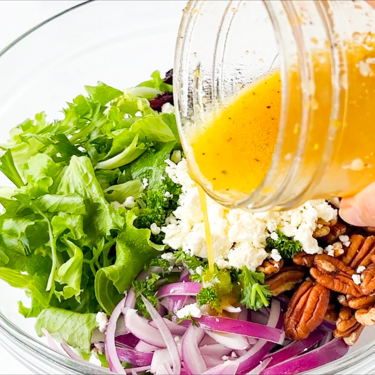 add dressing to the salad in a bowl