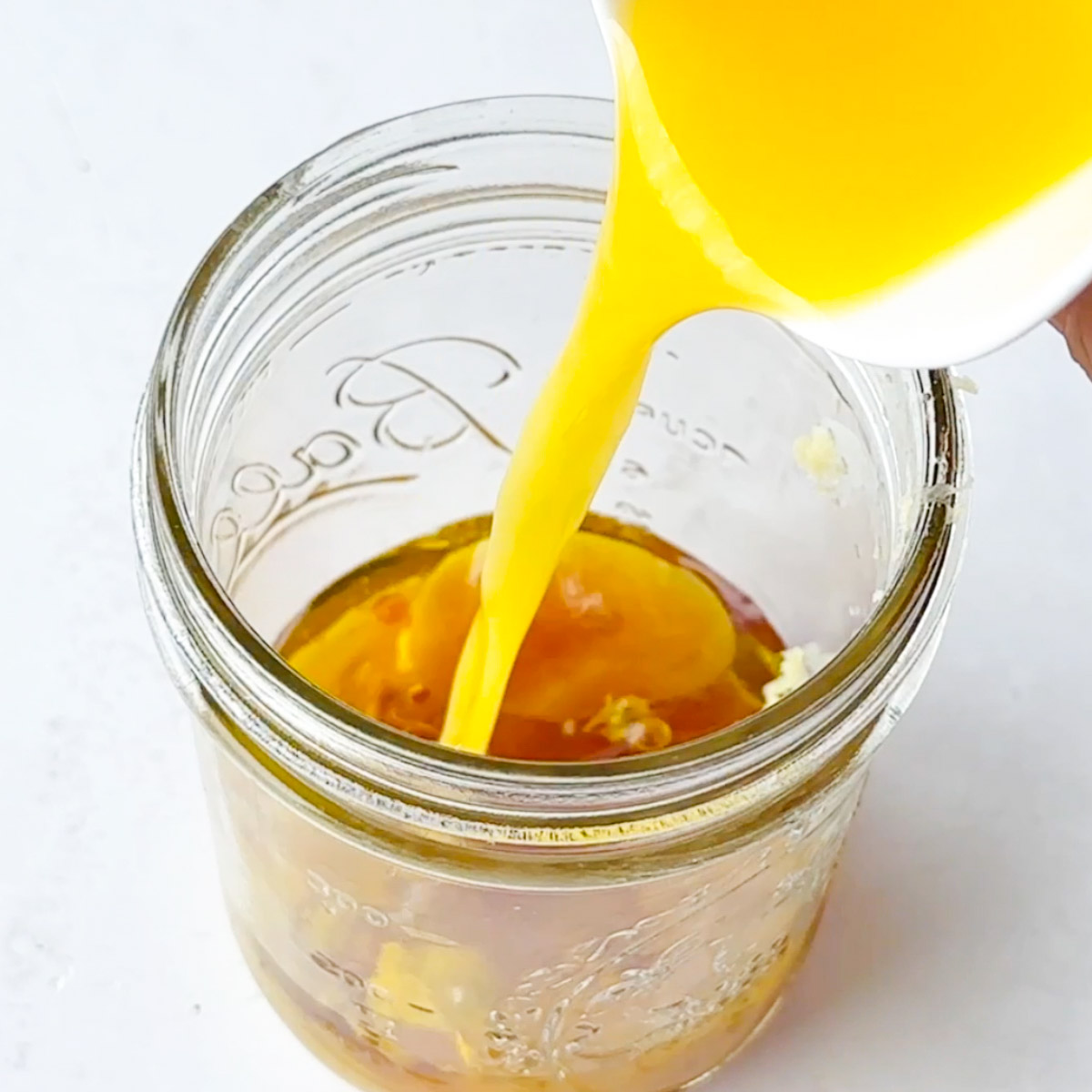 add orange juice to the jar