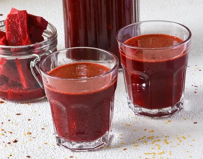 Carrot Beet Kanji (Indian beverage) in two glasses 