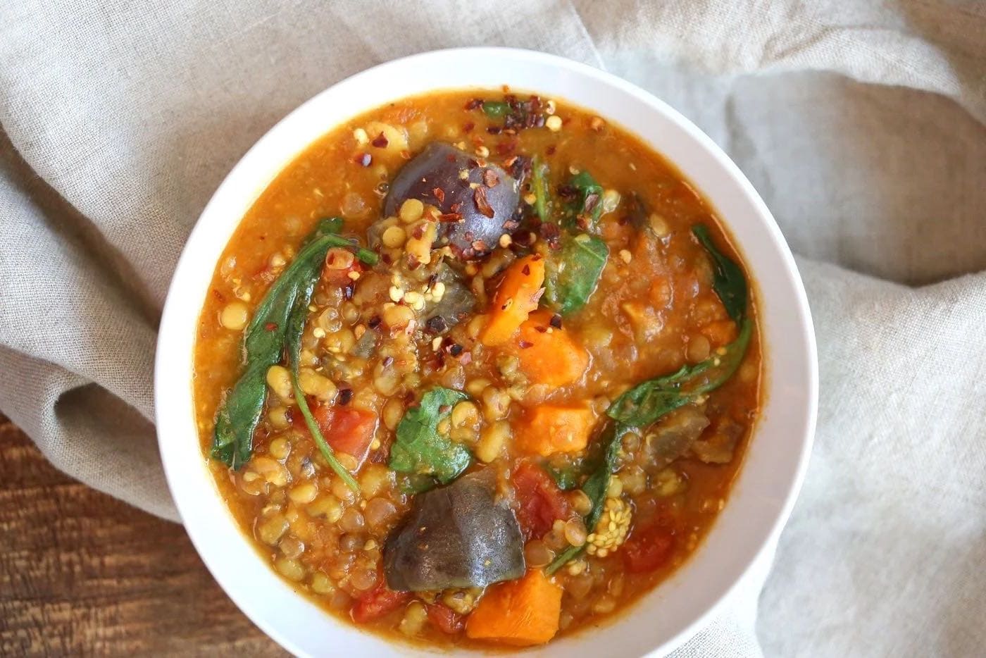 Eggplant sweet potato and lentil curry in a bowl 