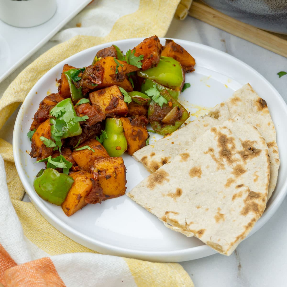 Aromatic Aloo Simla Mirch dish with tender potatoes and colorful bell peppers in a plate
