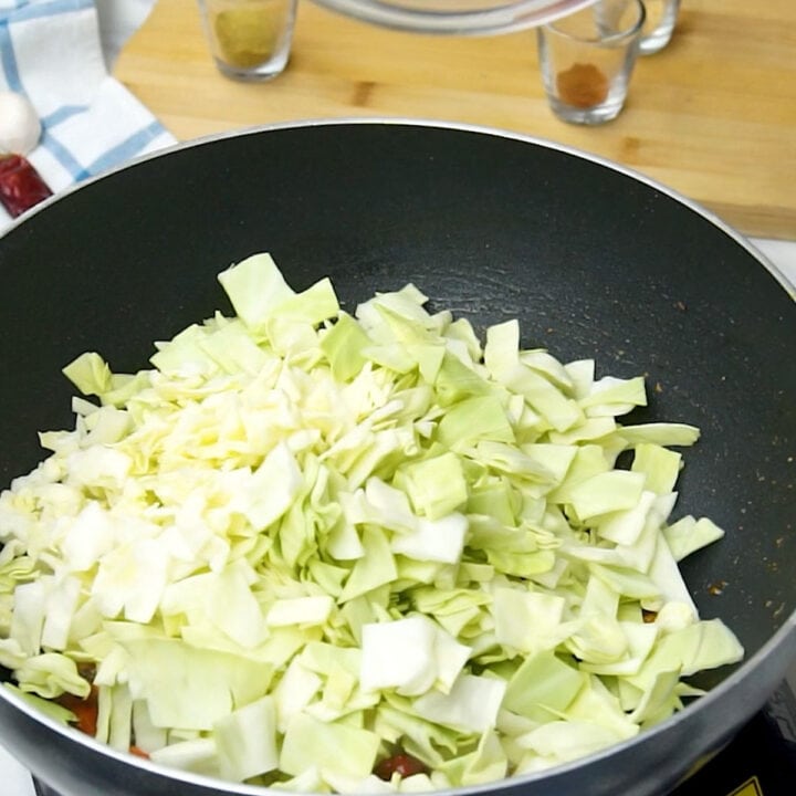 add chopped cabbage to the pan
