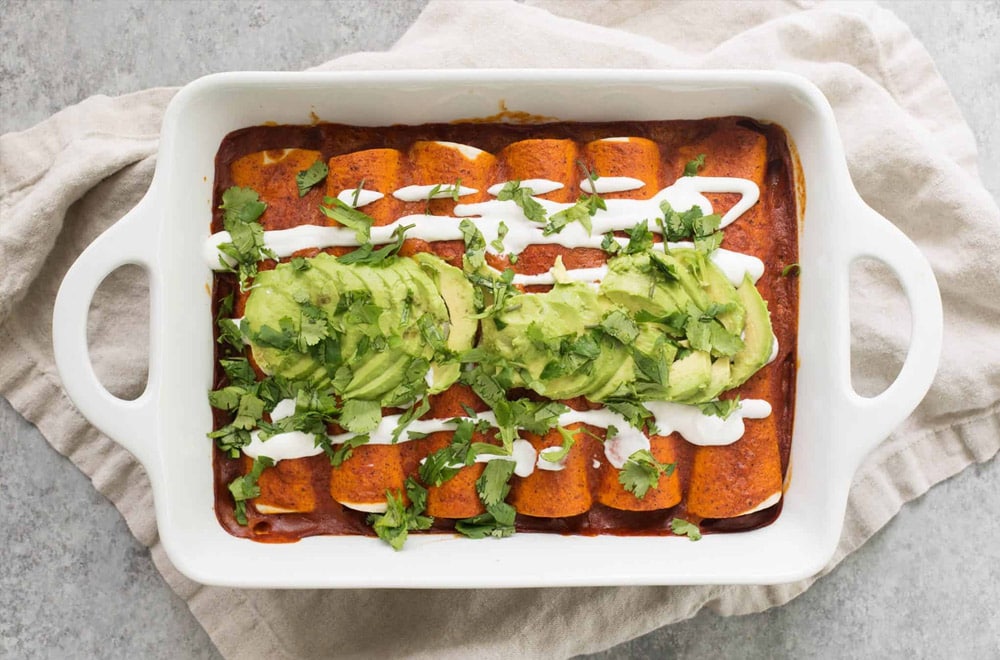 Fajita Enchiladas in a white serving dish