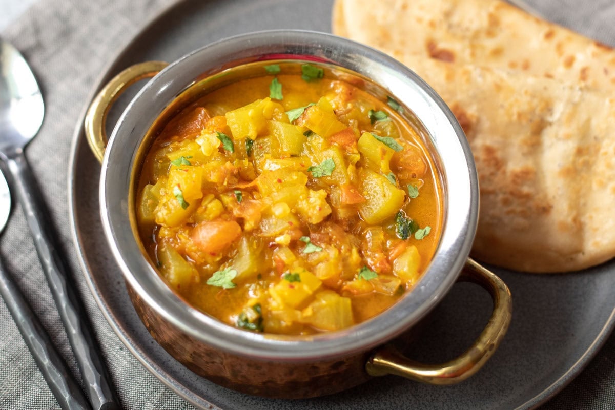 Lauki curry in a bowl garnished with cilantro