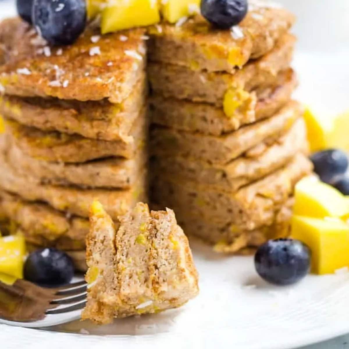 Mango pancake stack with a slice taken out.