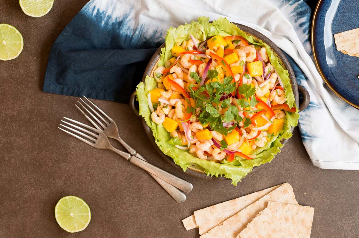 Mango shrimp ceviche in a brown bowl