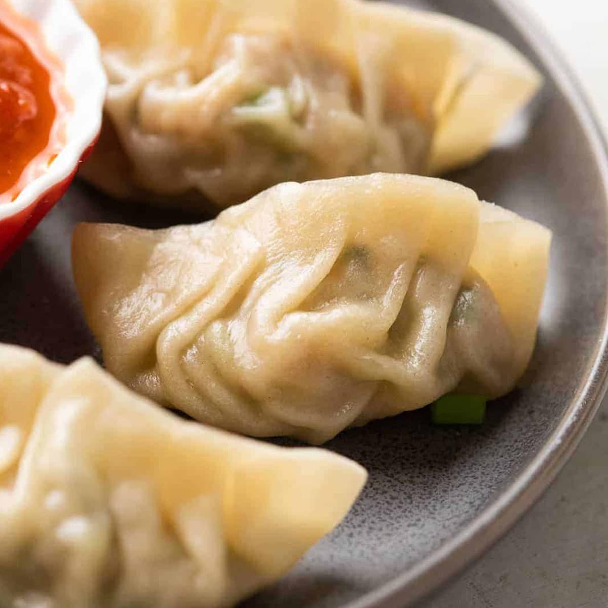 Momos served on a grey plate