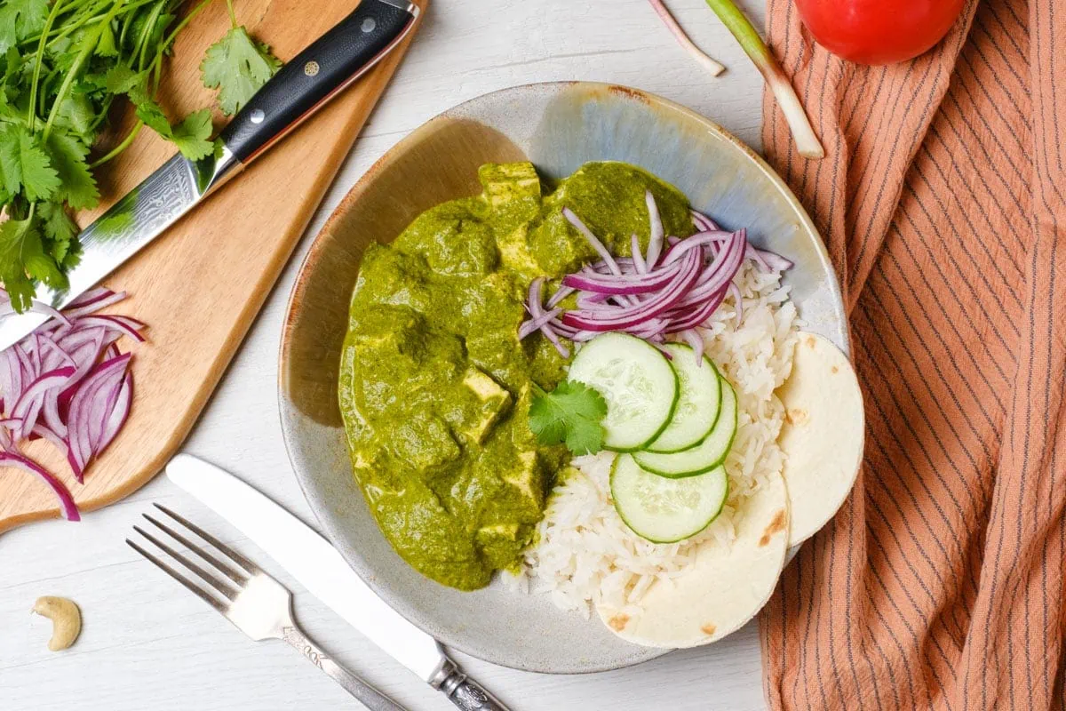 Vegan Palak Tofu in a green curry with cashew cream and spices in a bowl